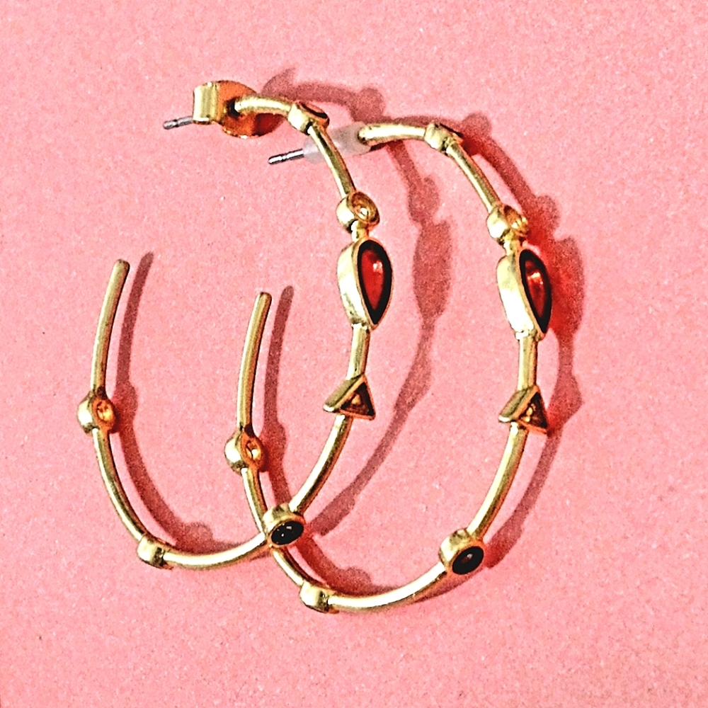 Coppery gold tone open ended hoop earrings with varying brown hue enamel inlay